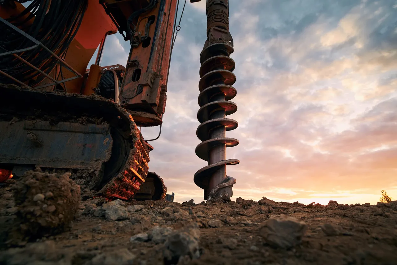 Tracked drilling rig performing soil boring for a geotechnical investigation
