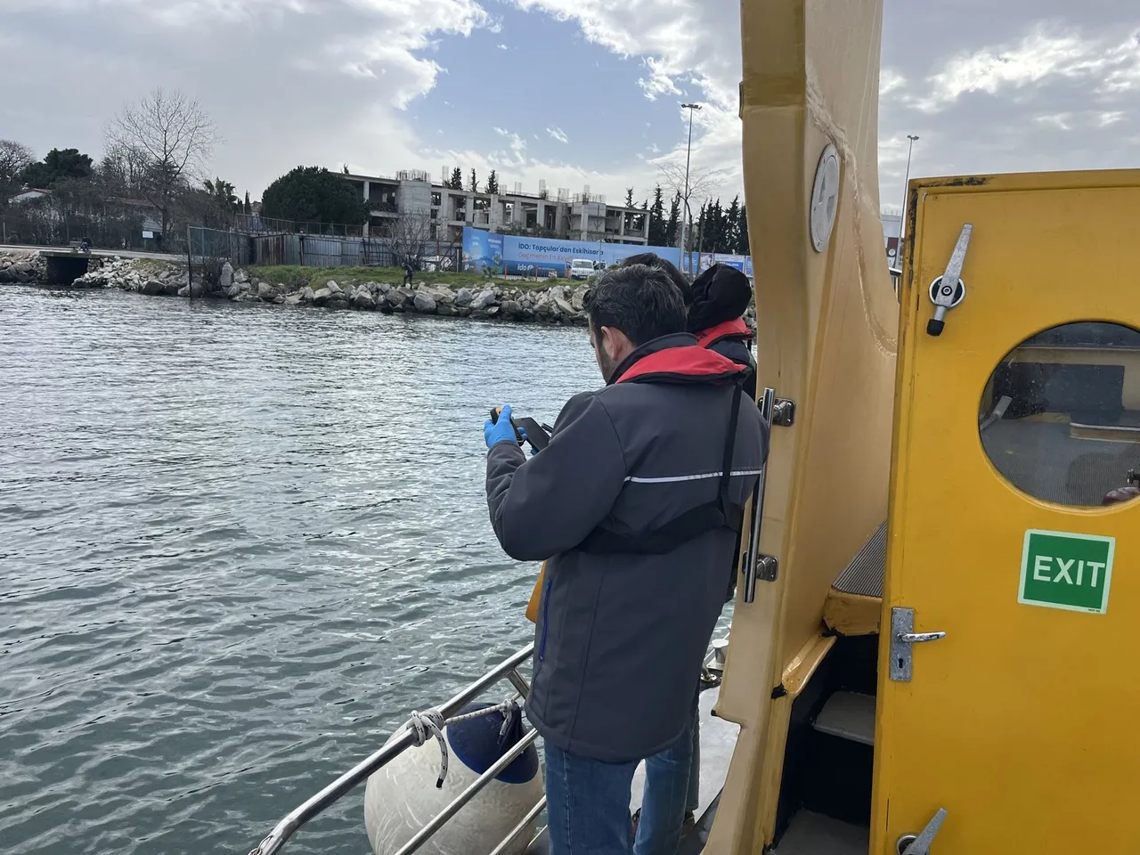 Water sampling from a boat during a hydrobiological study
