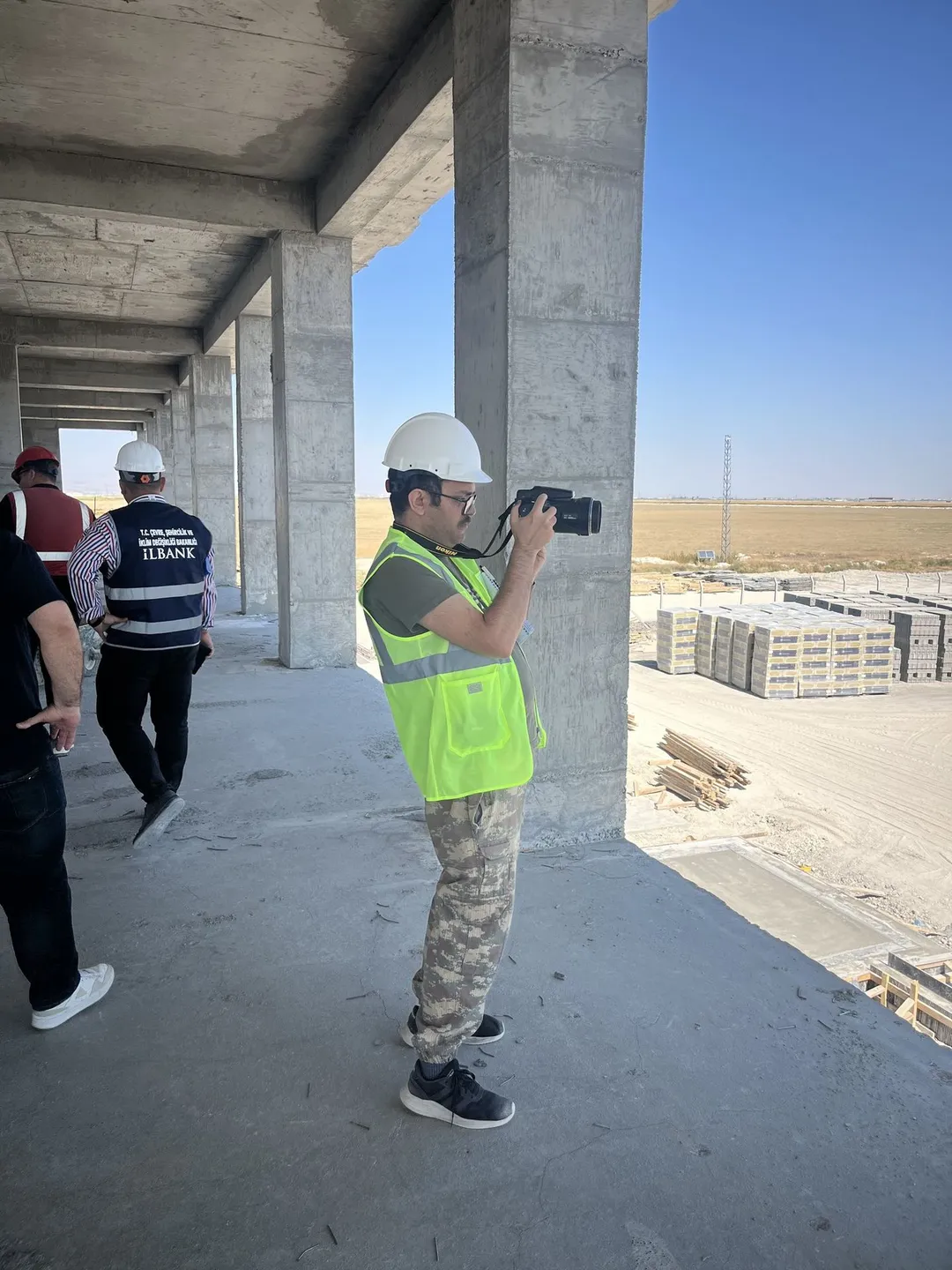 Specialist carrying out an inspection on a construction site according to the work schedule